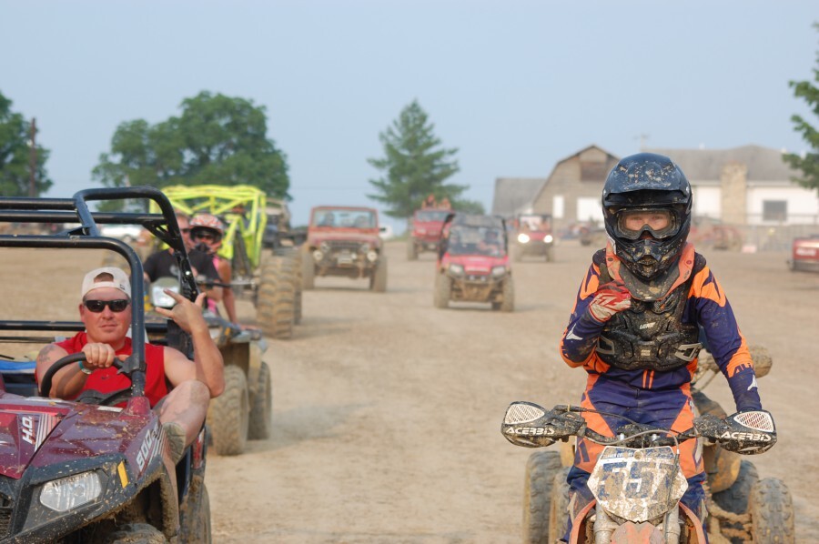 people riding motor bikes, quads, and ATVs