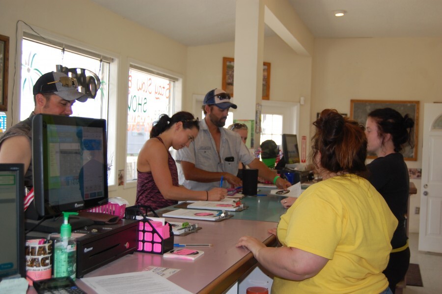 people checking in at desk