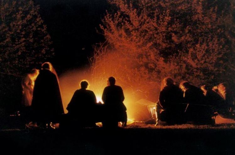 people around a campfire