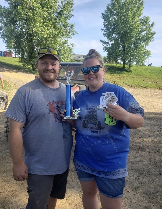 Sierra Lee and man with cards and trophy